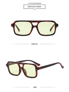 Close-up of retro square pilot sunglasses with demi amber frames and light green lenses
