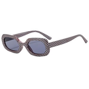 Square sunglasses featuring a pink and black houndstooth pattern frame with dark lenses