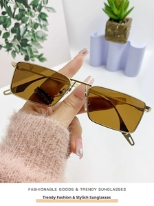 Detailed macro view of square metal sunglasses with tea lenses and double bridge design