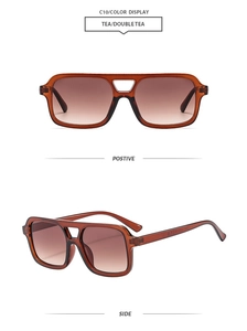 Detail view of tea brown gradient lenses on pilot sunglasses with double bridge frame