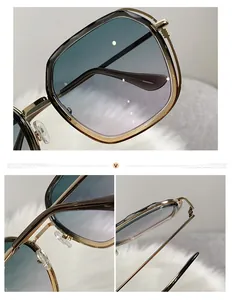 Detailed close-up of two-tone square metal sunglasses with gradient blue-grey lenses