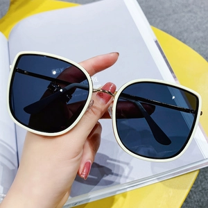Fashionable oversized square sunglasses with cream frame and dark blue lenses