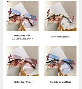 Detailed view of four frameless gradient sunglasses with gold floral rhinestone accents