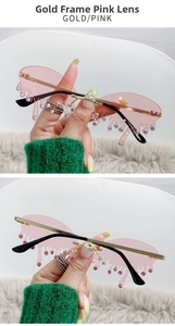 Détails de lunettes de soleil sans monture en forme de larme avec verres roses et strass