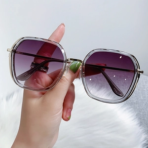 Fashionable oversized square sunglasses with purple gradient lenses and grey frames