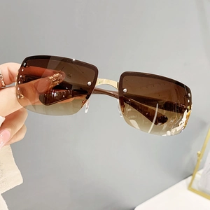 Modern oversized rimless sunglasses with gradient lenses and silver rivet accents