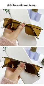 Detail of vintage gold metal frame sunglasses with brown lenses on minimalist stone