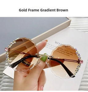 Detail of rimless round sunglasses with wavy crystal edges and brown gradient lenses