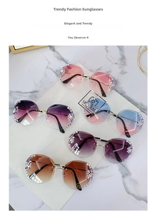 Detail of five rimless gradient sunglasses with crystal flower accents and metal temples