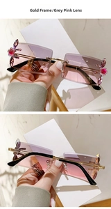 Detail of square rimless sunglasses with gold metal temples and crystal flower accents