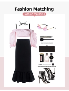 Flat lay of pink off-shoulder top and black mermaid skirt with fashion accessories