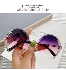 Detail of rimless round sunglasses with purple pink gradient lenses and rhinestones