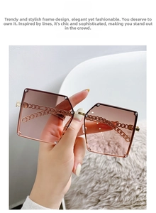 Detail of square oversized sunglasses with rose gold metal chain and silver studs