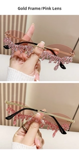 Detail of rimless angel tear sunglasses with pink dripping crystals and gold metal frame