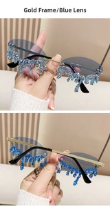 Detail of rimless sunglasses with gold frames and blue teardrop rhinestone fringe