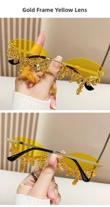 Detail of gold rimless sunglasses with yellow lenses and liquid teardrop diamond accents