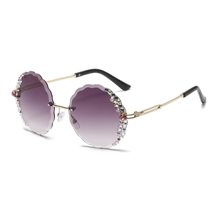Frameless round sunglasses with purple gradient lenses and luxury rhinestone flower decor