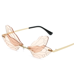 Frameless dragonfly wing sunglasses with pink gradient lenses and gold metal temples