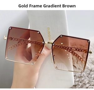 Detailed macro of gold chain temples and gradient brown lenses on square oversized sunglasses