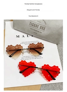 Detail of heart-shaped rimless sunglasses with wavy edges in brown and red colors