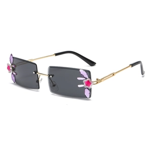 Chic rimless square sunglasses with gold metal frame and crystal flower details