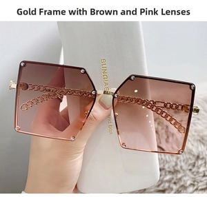 Detail of oversized chain temple sunglasses with gradient brown and pink lenses