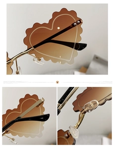 Detail of rimless heart sunglasses featuring scalloped edges and gold metal hinges