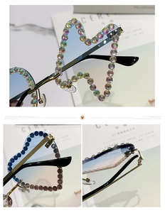 Detailed macro view of heart-shaped rimless sunglasses with colorful rhinestones