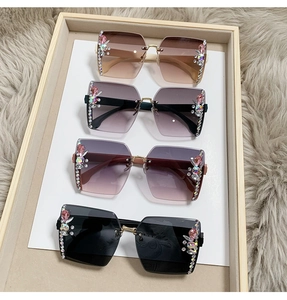 Detail of luxury rimless sunglasses with rhinestone accents and gradient lens color options