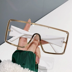 Oversized white square sunglasses with gold metal frames and silver rivet accents