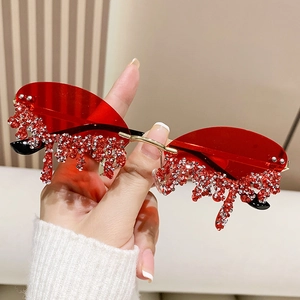 Fashionable rimless angel tears sunglasses with red lenses and dripping crystal rhinestones