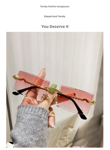 Detail of pink gradient rimless sunglasses with gold metal wave temples and animal carving