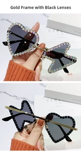 Detail of rimless heart and butterfly metal sunglasses with sparkling rhinestones