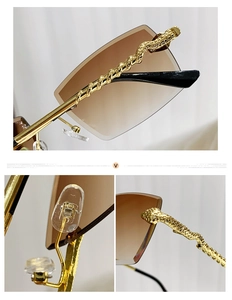 Detail of snake-shaped golden temples and brown gradient lenses on rimless sunglasses