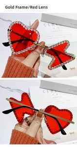 Detail of red rimless sunglasses with asymmetrical heart and bow shaped rhinestone lenses