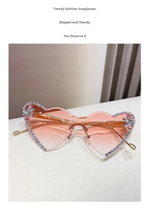 Detail of heart-shaped gradient lenses with sparkling rhinestones and gold metal temples