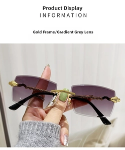 Detailed view of snake-embossed gold metal temple on rimless gradient grey sunglasses