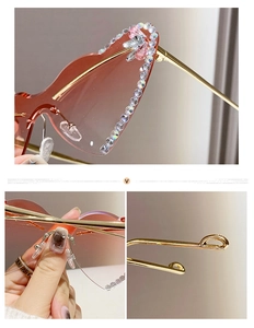 Close-up of heart-shaped rimless sunglasses with gradient lenses and rhinestone flower details