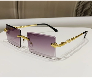 Detailed shot of golden snake pattern metal frames on purple rimless rectangle sunglasses