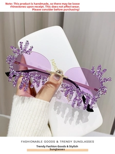 Close-up of handmade purple teardrop sunglasses with rimless diamond-encrusted edges