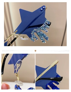 Macro view of blue star-shaped rimless sunglasses with gold hinges and rhinestones