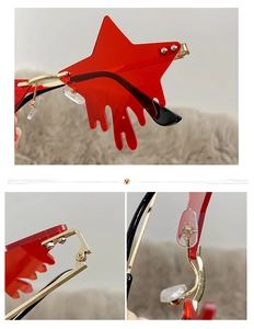 Detailed macro view of star-shaped red lenses with liquid drip effect and gold hinges