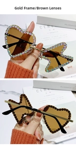 Close-up of gold metal rimless sunglasses with heart and butterfly crystal lenses