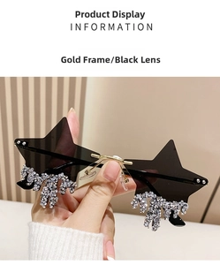 Close-up of gold star sunglasses with black gradient lenses and dangling crystal tassels