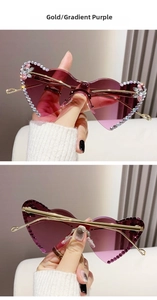 Close-up of heart rimless sunglasses with purple gradient lenses and rhinestone trim
