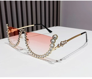 Detailed view of pink gradient cat-eye sunglasses with rhinestone semi-rimless frames