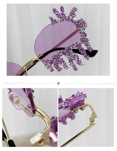 Detailed close-up of teardrop rimless sunglasses with purple rhinestones and gold metal frame