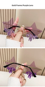 Detail of star-shaped rimless sunglasses with gold frame, purple lenses and crystal fringe