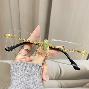 Chic rimless square sunglasses with golden spiral metal temples and lion head emblem