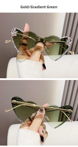Detail of heart rimless sunglasses with gradient green lenses and crystal flower accents